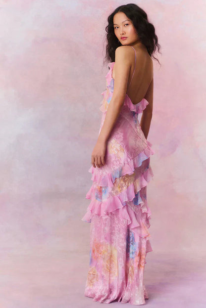 Back and side view of pink floral slip maxi dress with low back and cascading ruffle layers