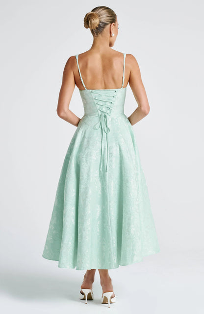Back view mint green floral midi dress with lace-up corset back, wide straps, and full fit-and-flare skirt