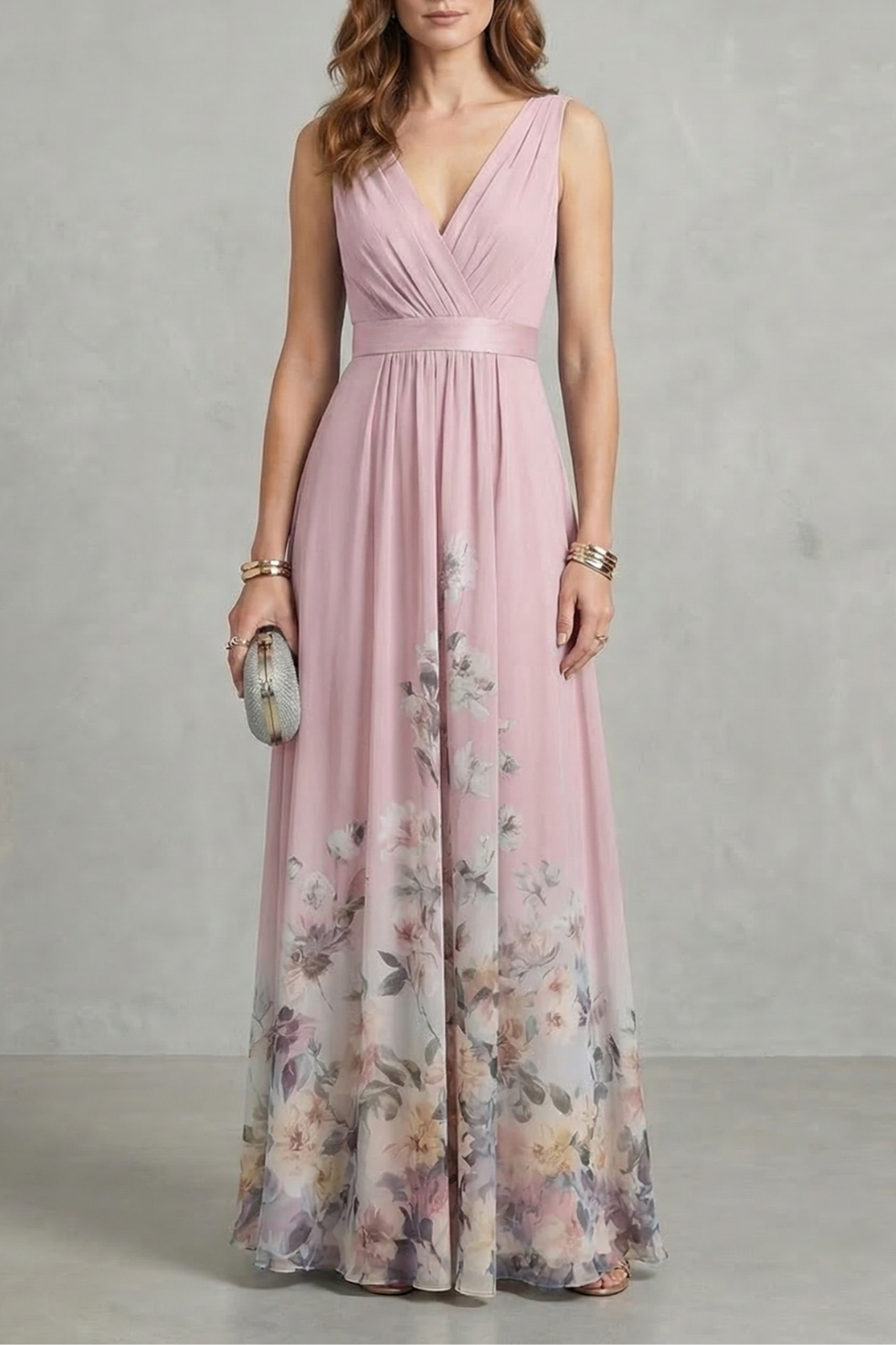 Soft pink floral V-neck maxi dress with a ruched bodice and flowing skirt, adorned with a subtle floral pattern, ideal for wedding guests.