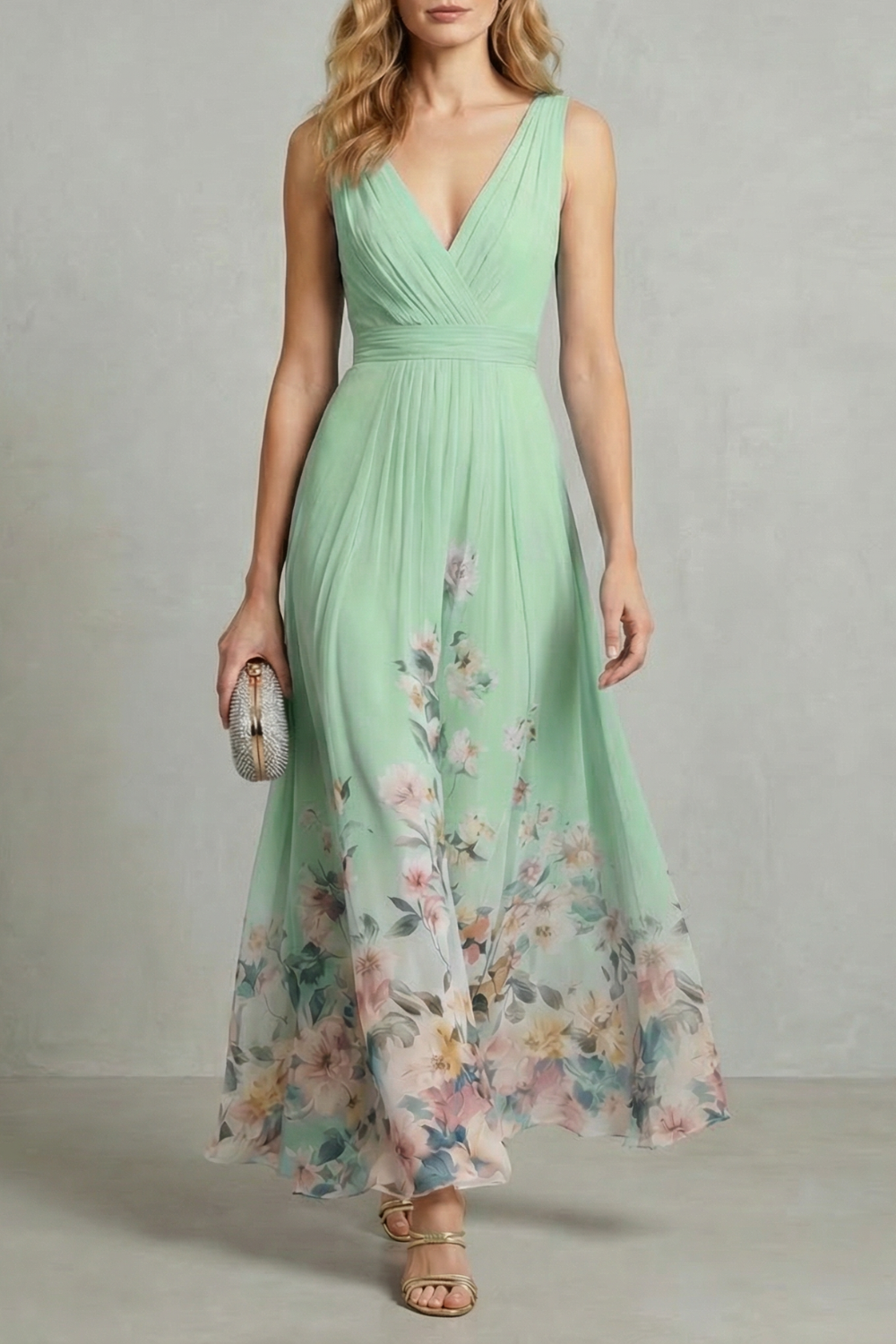 Full-length view of a mint green floral ombre maxi dress with a v-neck and pleated bodice, ideal for vacation outfits.