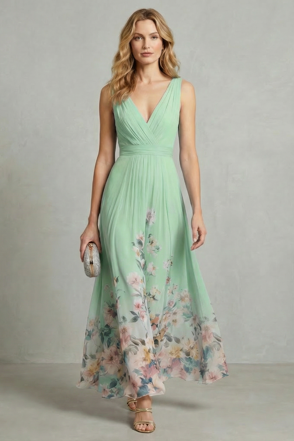 Front view of a women's mint green floral v-neck ombre maxi dress, featuring a soft botanical print on the skirt.