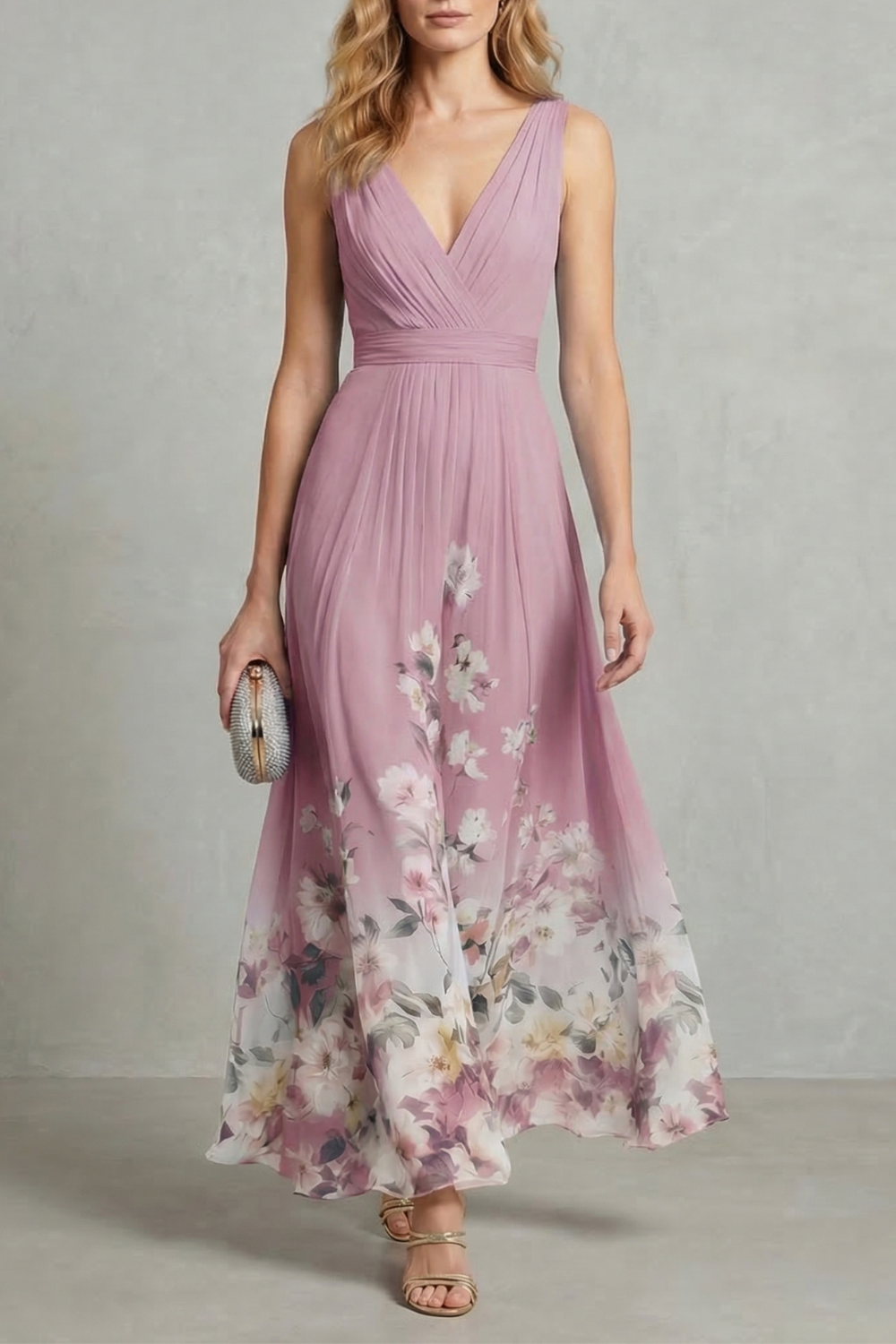 Full-length view of a dusty rose floral ombre maxi dress with a v-neck and pleated bodice, an elegant dress for wedding guests.