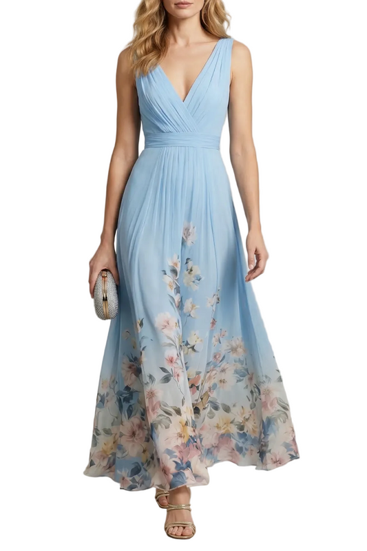 Full-length view of a light blue floral ombre maxi dress with a v-neck and pleated bodice, perfect for wedding guests.