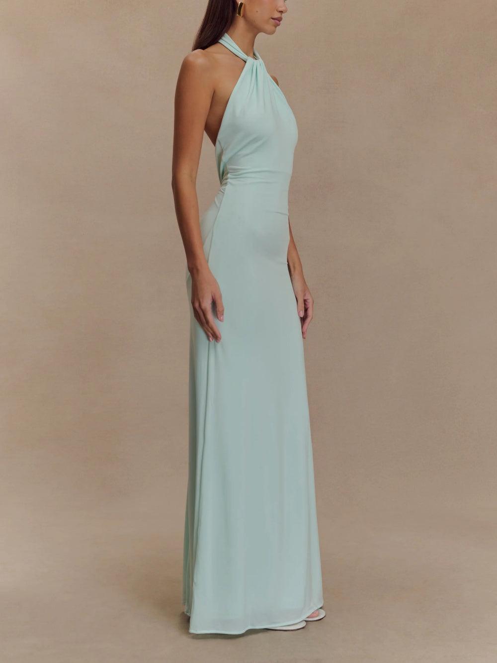 Side view of mint halter ruched maxi dress showing smooth skirt drape and fitted waist