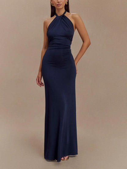 Navy halter ruched maxi dress for wedding guest with bodycon fit, full-length front view