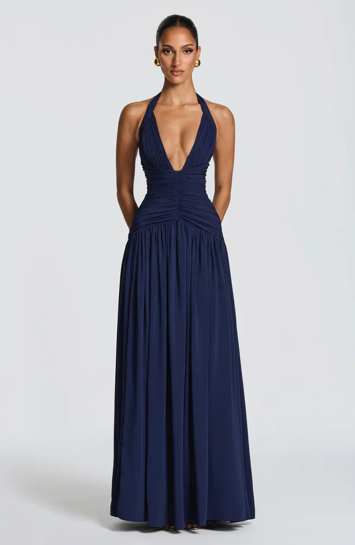 Navy blue halter V-neck backless maxi dress with ruched waist and flowing skirt, front view