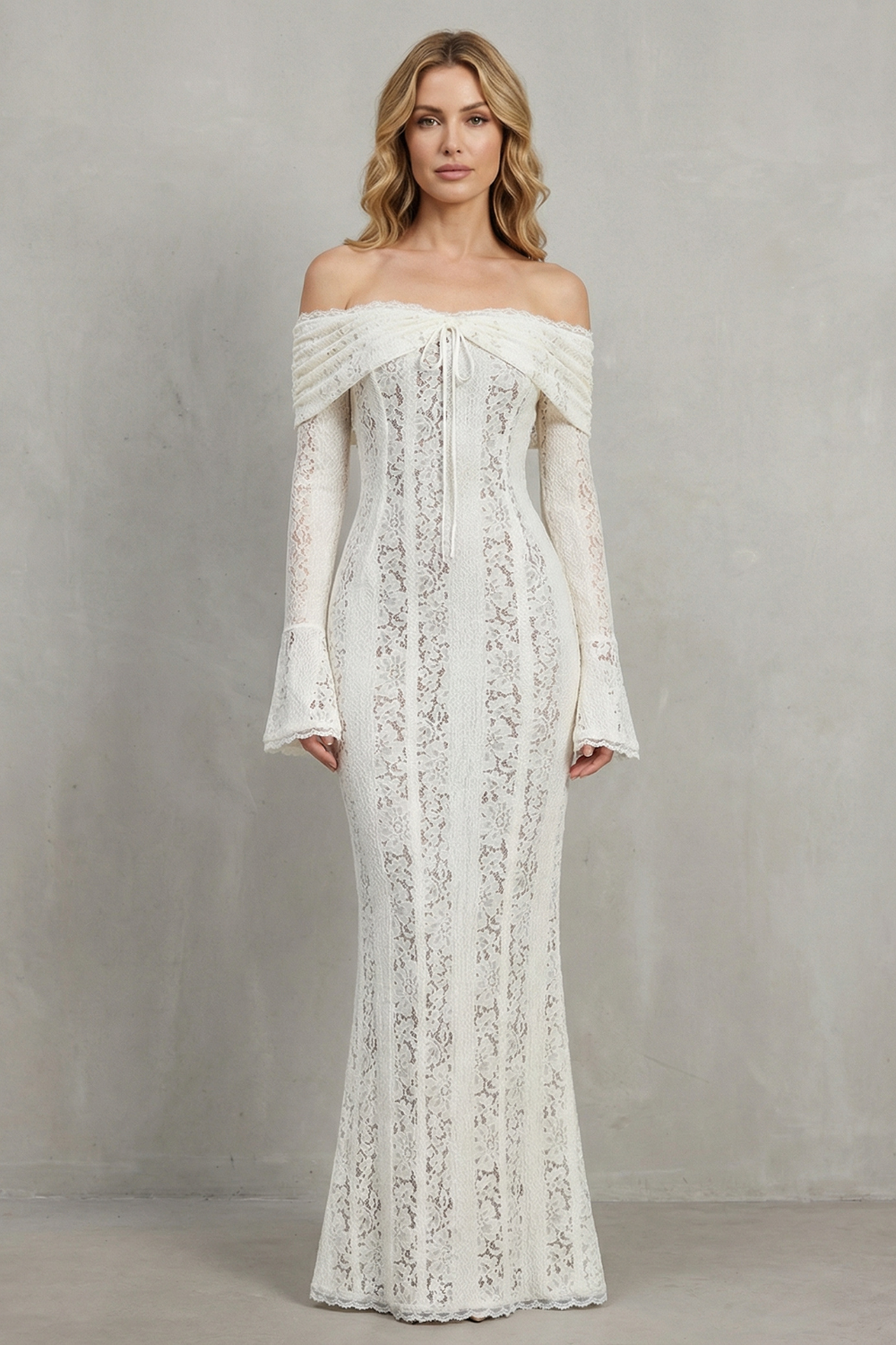 Full front view of a white off-shoulder lace maxi dress, featuring a fitted bodice, long bell sleeves, and a delicate lace pattern throughout.