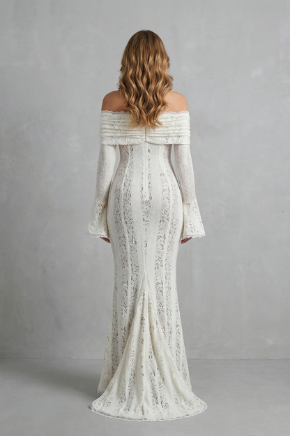 Back view of a white off-shoulder lace maxi dress, highlighting the floor-length skirt with a subtle train and the elegant silhouette.