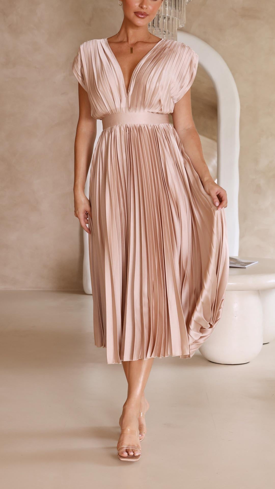 Champagne-colored pleated V-neck midi dress for women, featuring a cinched waist and a full pleated skirt, an elegant choice for wedding guests.