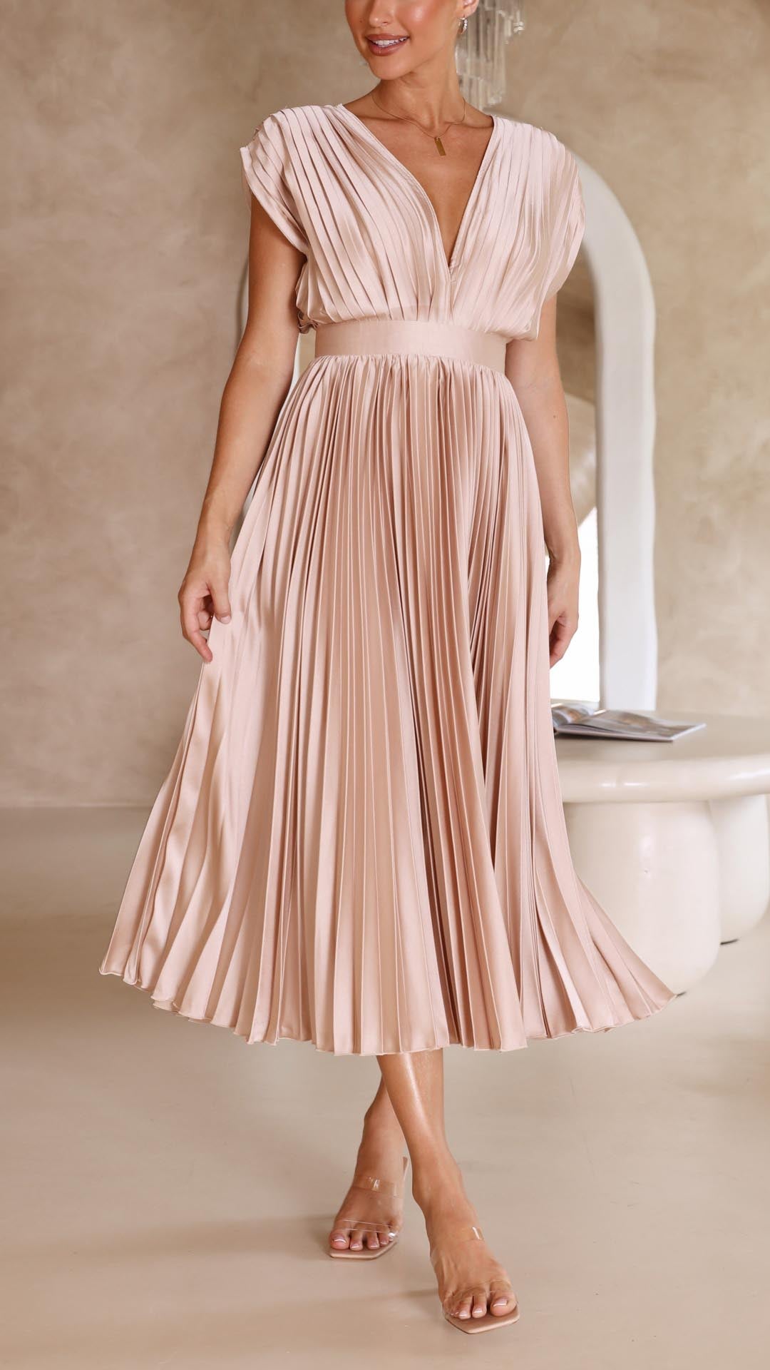 Champagne pleated midi dress for women, with a deep V-neck and short sleeves, showing the graceful movement of the skirt, ideal for a wedding guest dress.