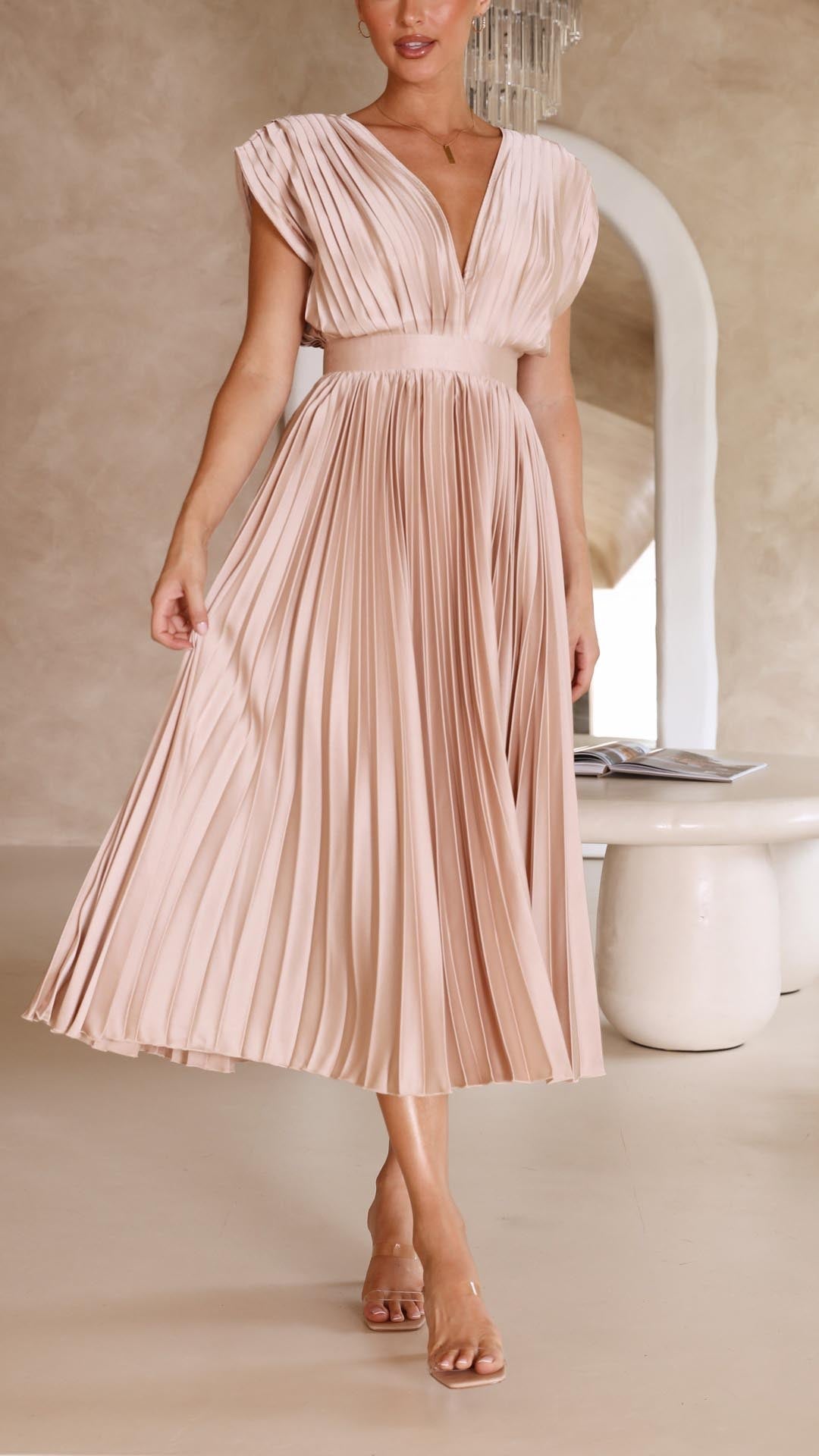 Full view of the champagne pleated V-neck midi dress, highlighting the flowing fabric and elegant design, a beautiful midi dress for women.