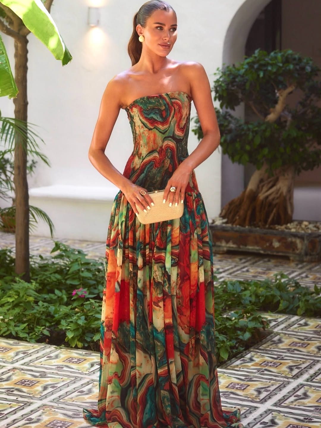 Front view strapless printed maxi dress with multicolor marble pattern and gathered skirt, wedding guest outfit