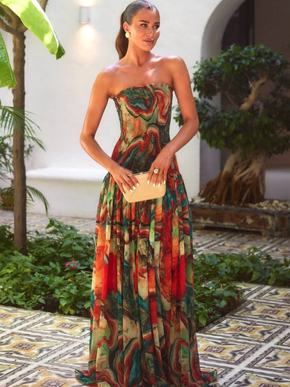 Front view strapless printed maxi dress with multicolor marble pattern and gathered skirt, wedding guest outfit