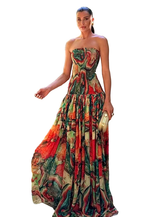 Women's strapless printed maxi dress in green and red swirl, flowy skirt wedding guest look