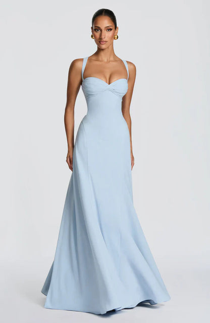Light blue wedding guest corset maxi dress with ruched bust and smooth skirt, three-quarter side view