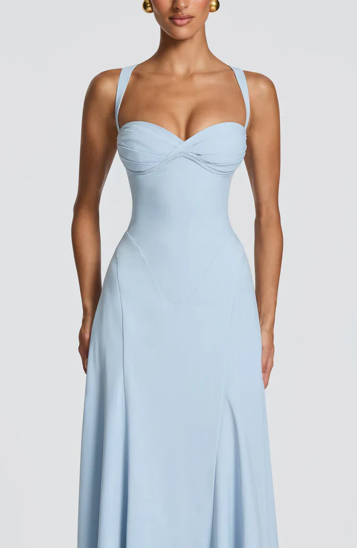 Close-up of light blue sweetheart neckline with ruched bust and structured corset seams on maxi dress