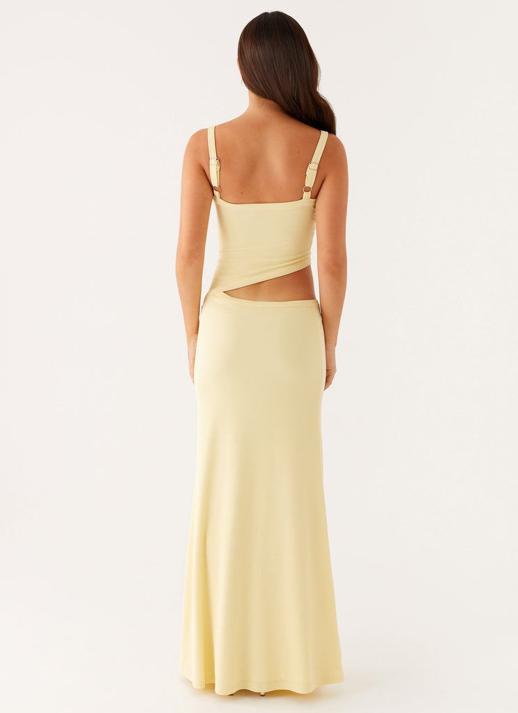 Back view of the light yellow bodycon maxi dress, showing the open back and side cut-out details.