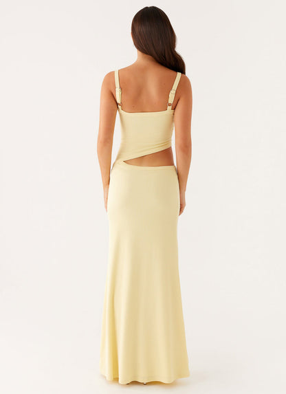 Back view of the light yellow bodycon maxi dress, showing the open back and side cut-out details.