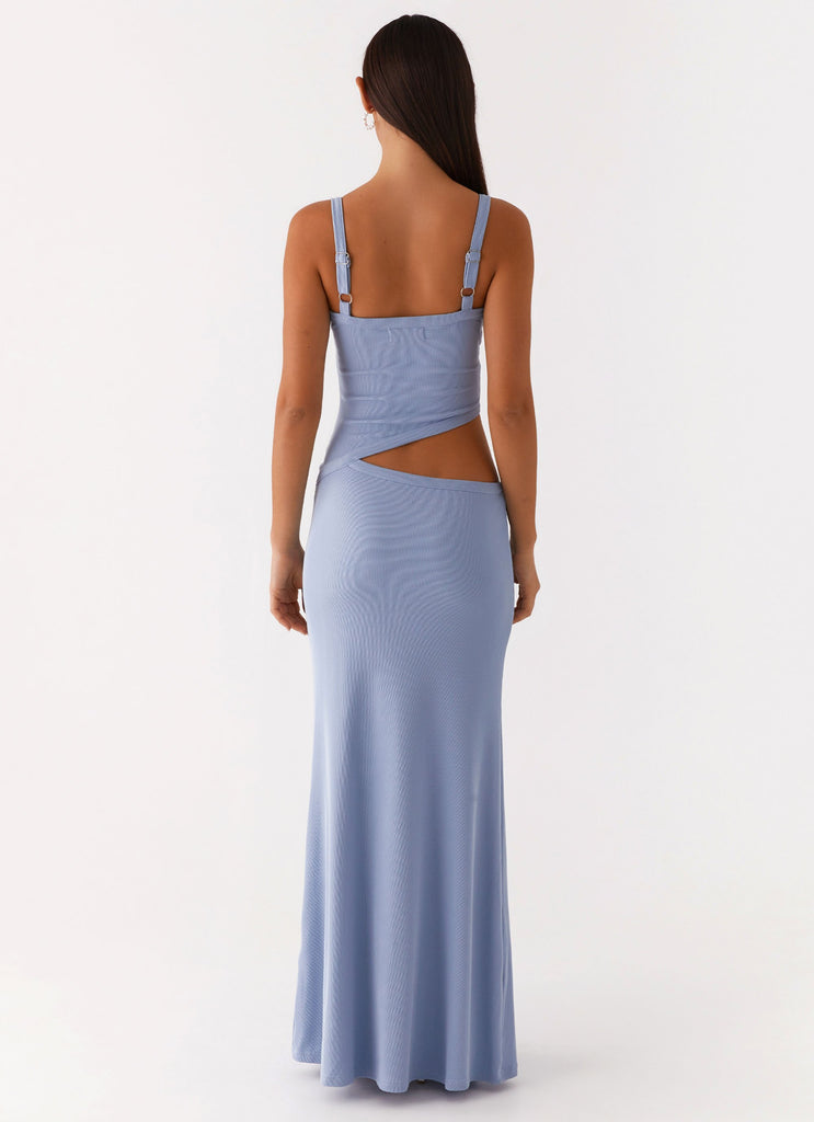 Back view of a women's bodycon maxi dress in light blue, featuring an open back and side cut-out design.