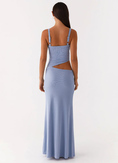 Back view of a women's bodycon maxi dress in light blue, featuring an open back and side cut-out design.