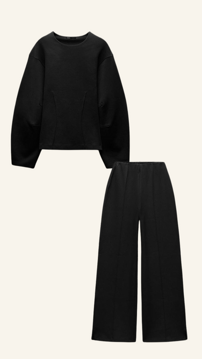 Black two-piece set with long sleeve shirt and womens wide leg pants, flat lay front view