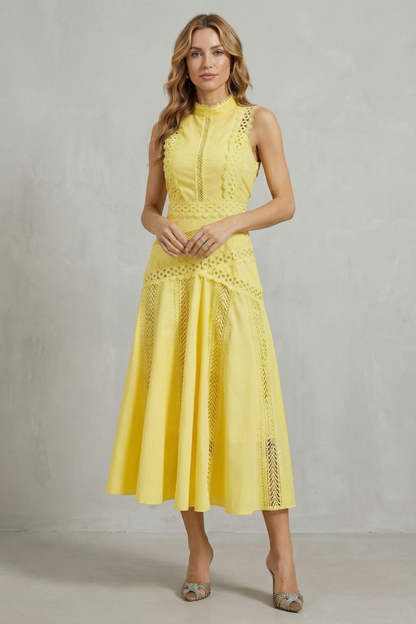 Front view of a women's bright yellow high neck midi dress, showing full length with lace inserts and flared skirt.