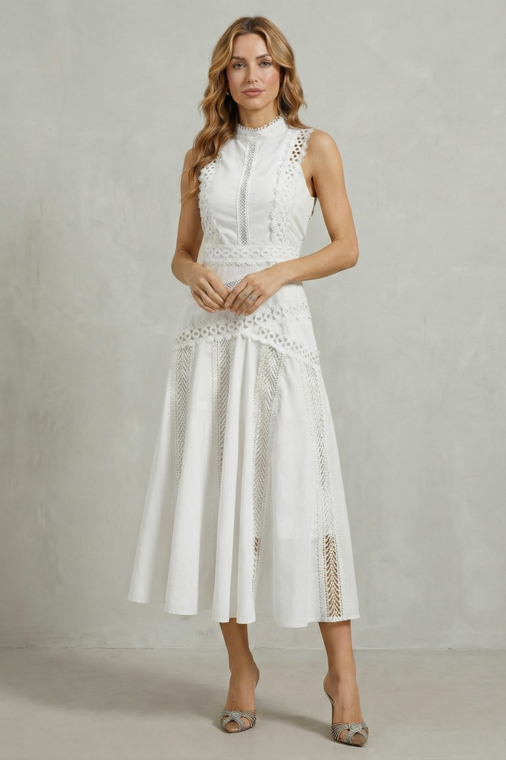 Front view of a women's elegant white high neck midi dress, ideal for vacation outfits or a chic event.