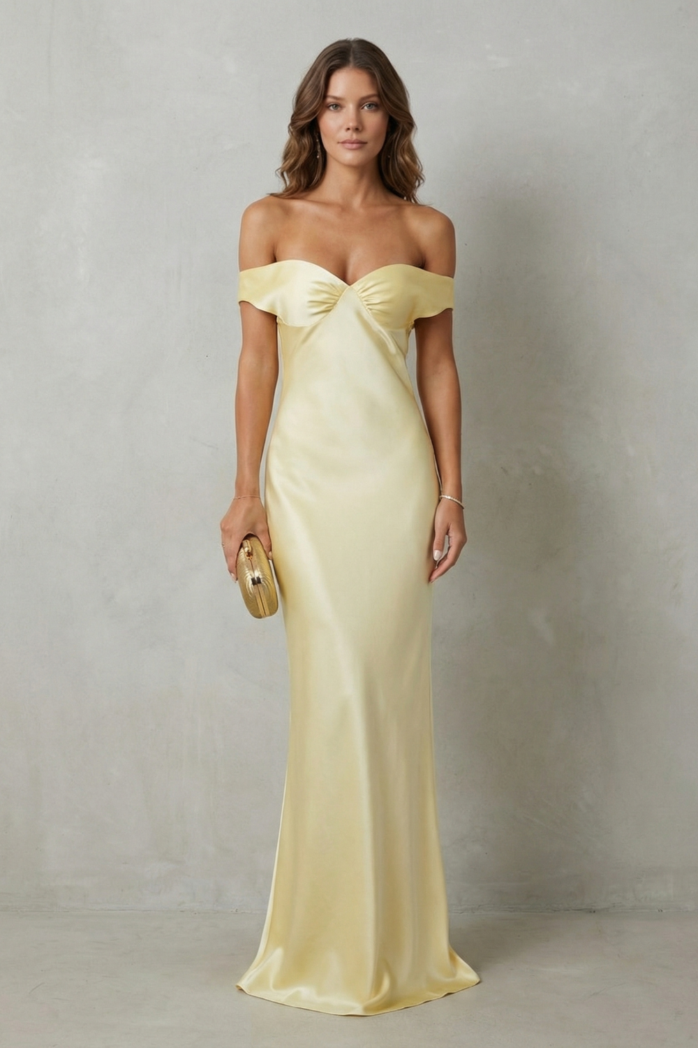 Full-length view of a yellow off-shoulder satin maxi dress, elegant for wedding guests or vacation outfits.
