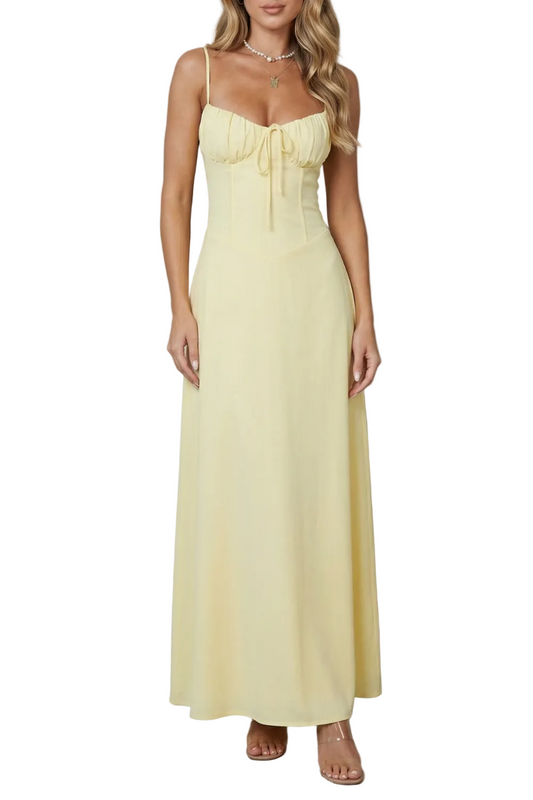 Front view of a women's yellow sweetheart neck maxi dress with delicate spaghetti straps and a ruched bodice, perfect for wedding guests.